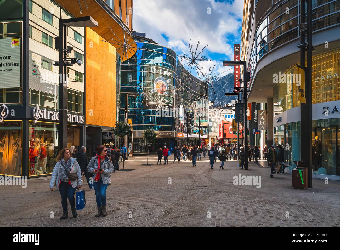 People duty free shopping, street with modern shops in Andorra Stock Photo