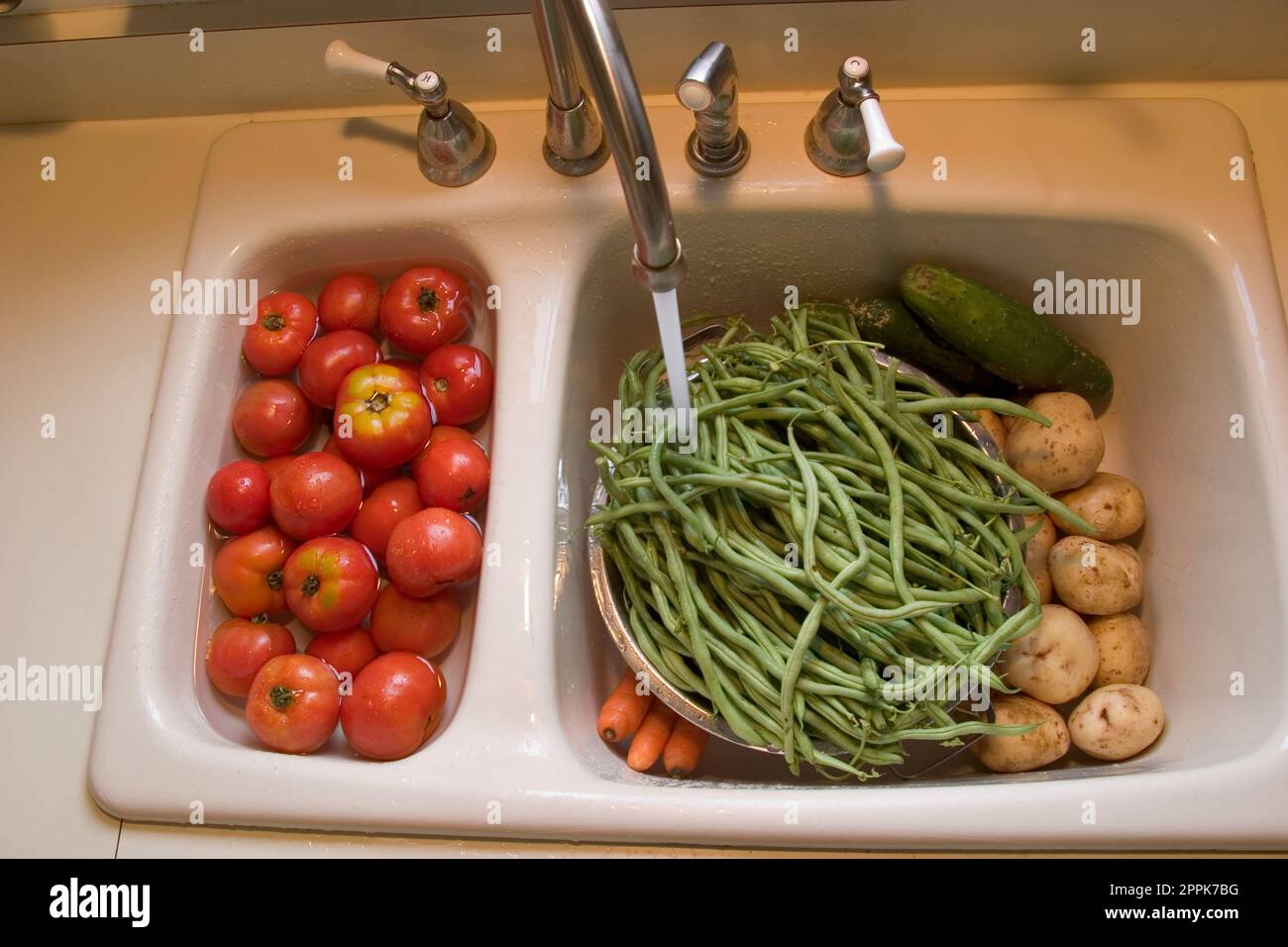 Washing vegetables from the garden Stock Photo Alamy