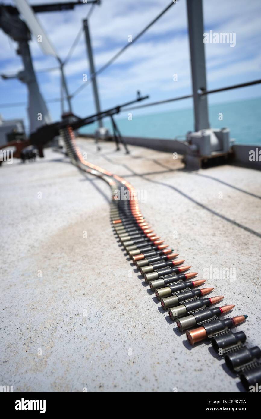 Machine gun belt loaded with cartridges Stock Photo