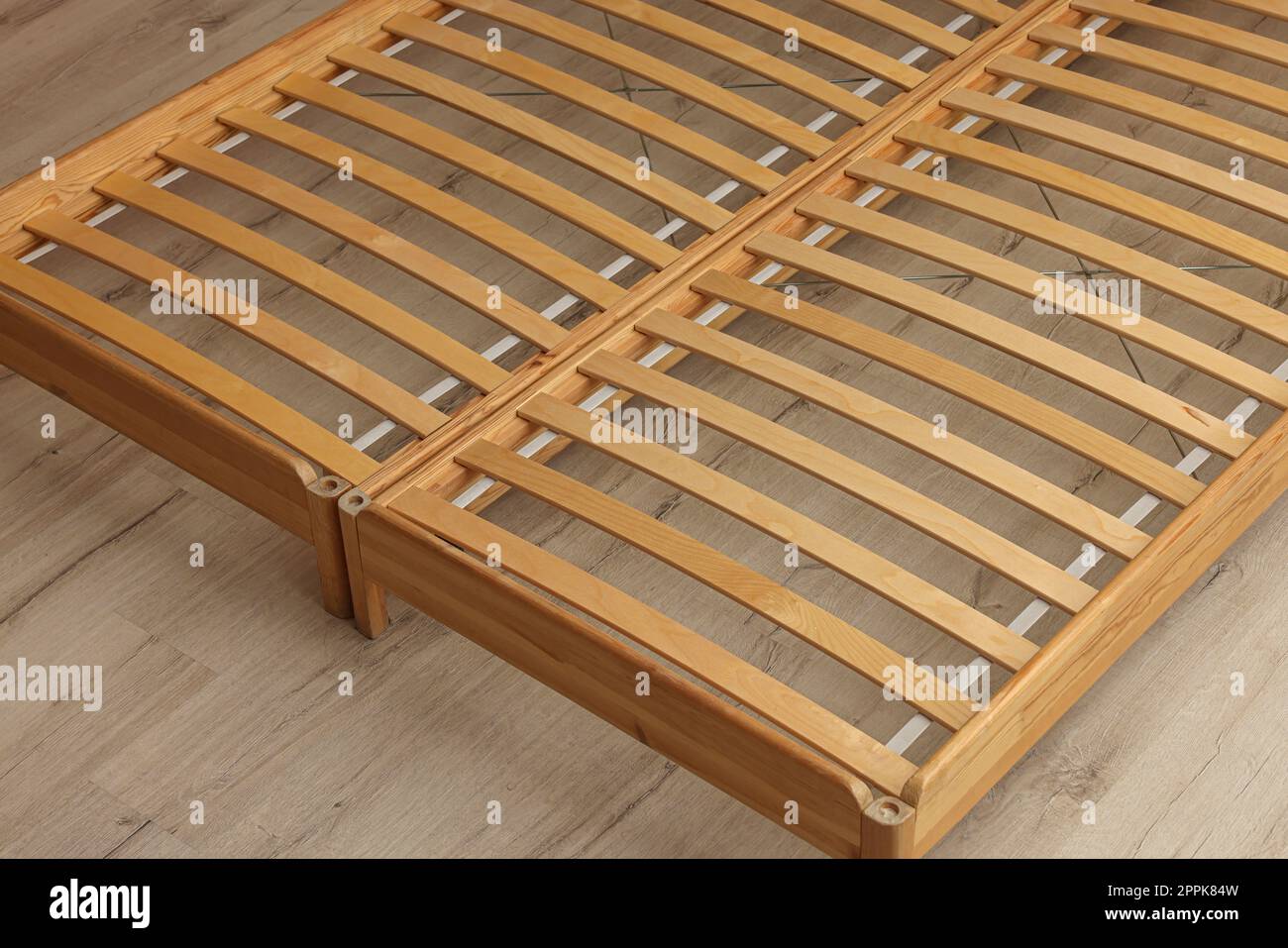 Wooden bed frame on floor, closeup view Stock Photo Alamy