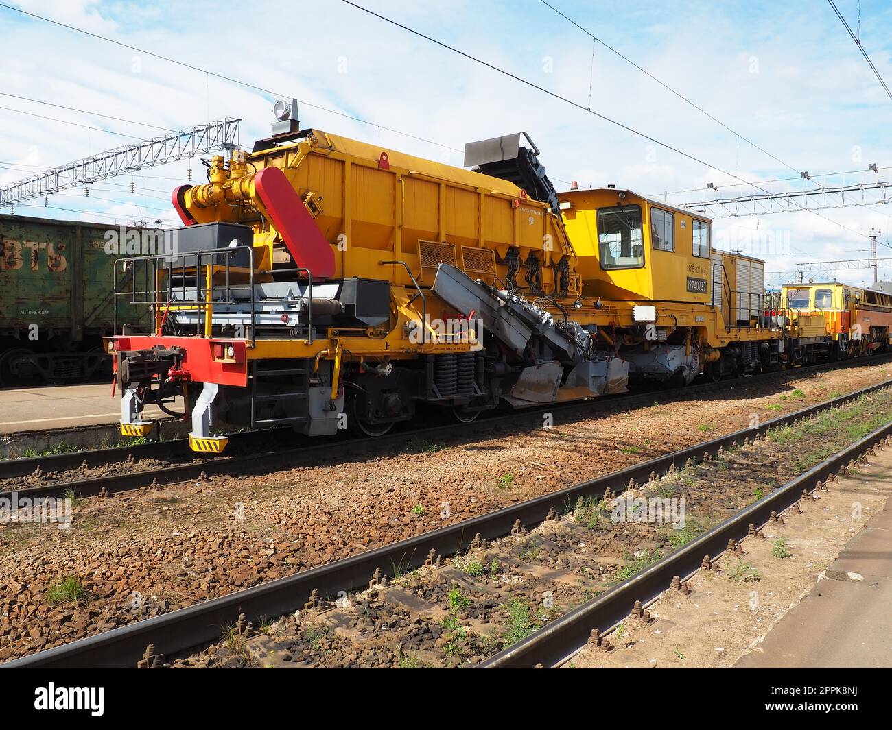 Svir, Russia August 6 2021 Train serving the railroad, snow and wood ...