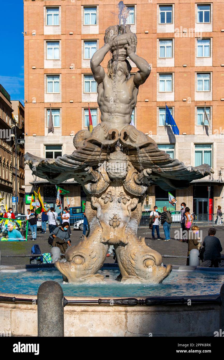17th century Fontana del Tritone (Triton Fountain) with dolphins heads, located in the Piazza Barberini, Rome, Italy Stock Photo