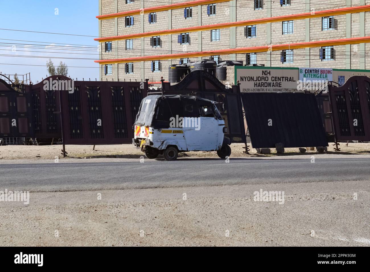 Kitengela, Kenya - 22 January 2023: The streets of Kitengela with small tuk tuk vehicles^. Stock Photo