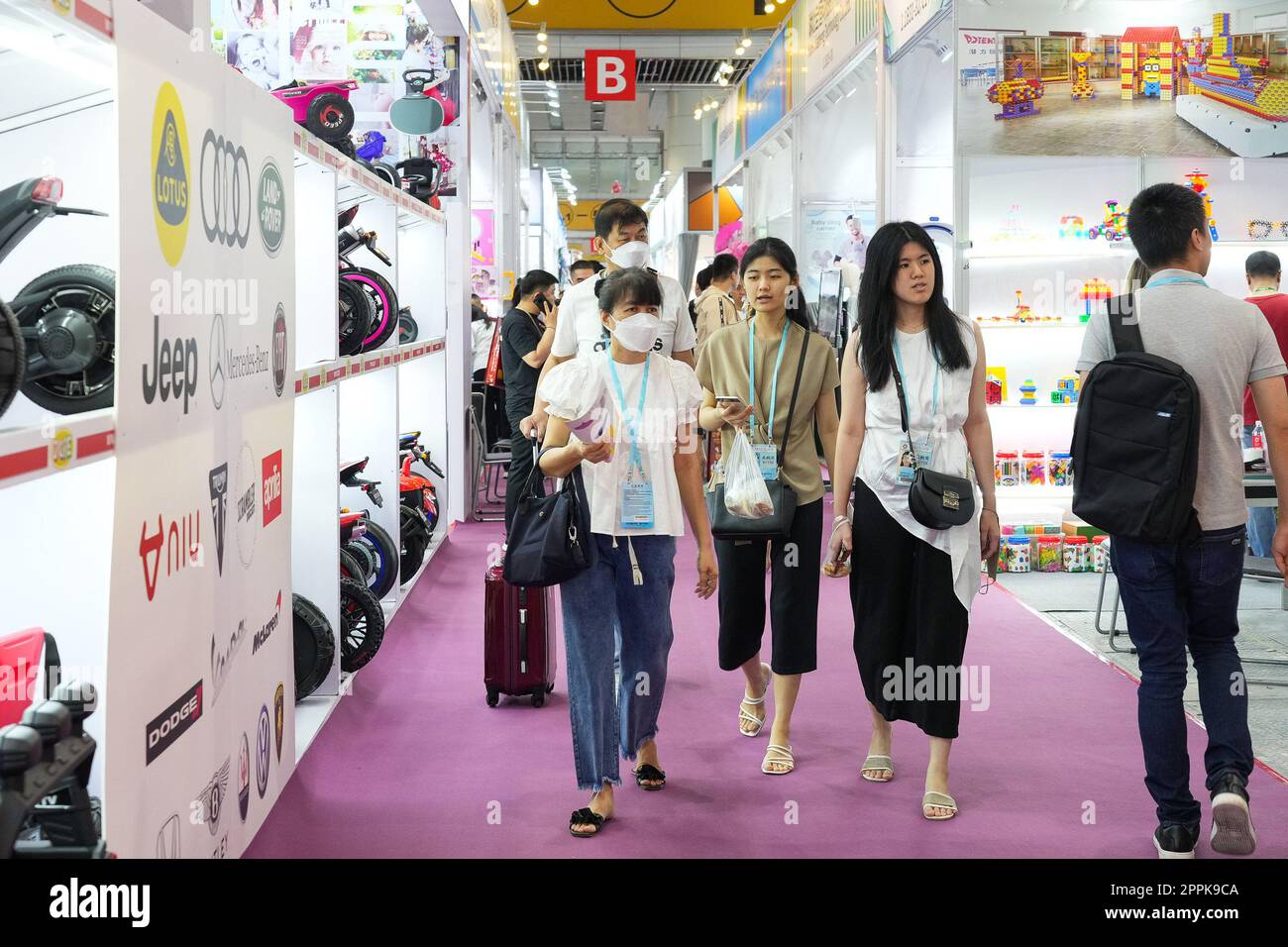 (230424) -- GUANGZHOU, April 24, 2023 (Xinhua) -- Djulia Hasan (L, front) visits the Maternity, Baby and Children Products exhibition section of the 133rd session of the China Import and Export Fair with her husband and daughters in Guangzhou, south China's Guangdong Province, April 23, 2023. Stephanie Jestina, an Indonesian girl studying in Guangzhou, comes from a family that runs a baby and children products company in Indonesia, and her mother Djulia Hasan travels between China and Indonesia all the year round on business trips.   When Stephanie heard that the 133rd session of the China Imp Stock Photo