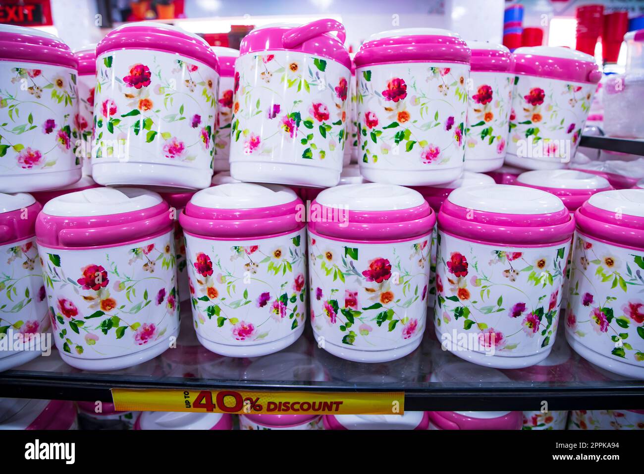 Colorful plastic hot pot lunch box for sale at a supermarket, in Bangladesh. Stock Photo