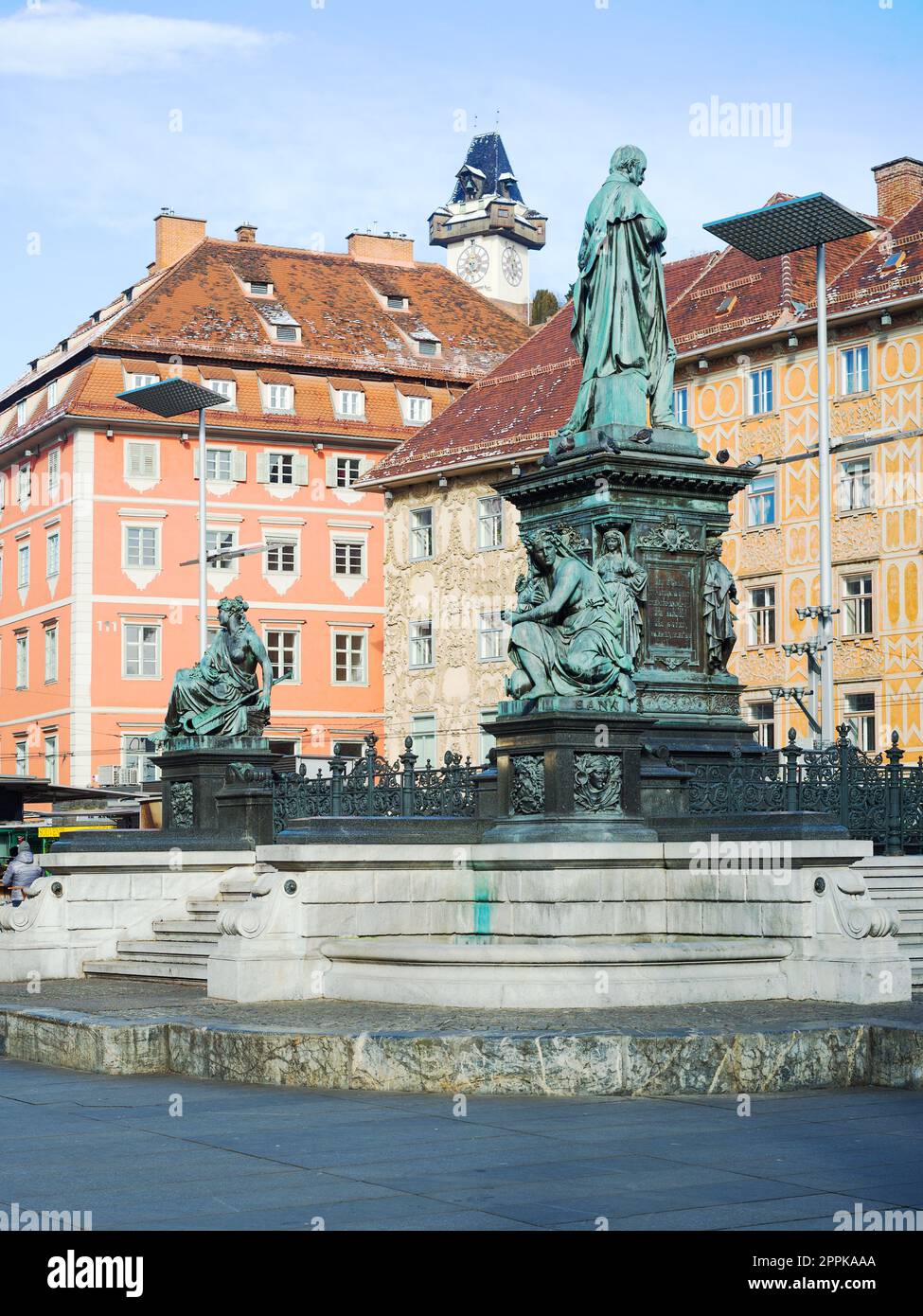 Statue in the middle of the Main Square of Graz and the Uhrturm Stock Photo