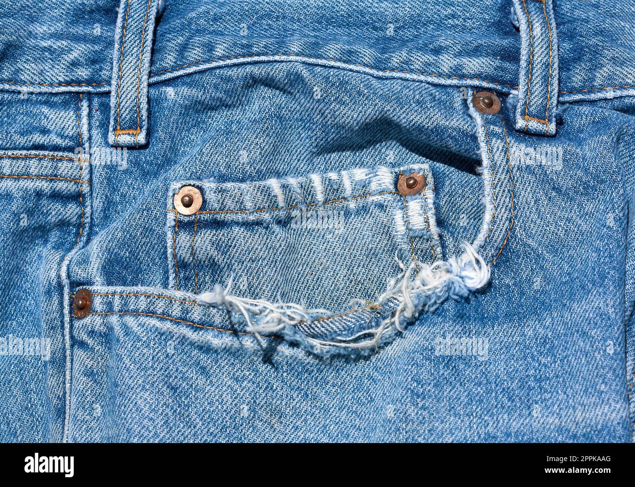 An old worn pair of blue jeans. Stock Photo