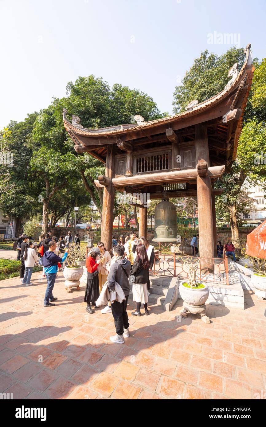 Hanoi, Vietnam, January 2023.  visitors in the large park with the historic buildings inside the temple of literature Stock Photo