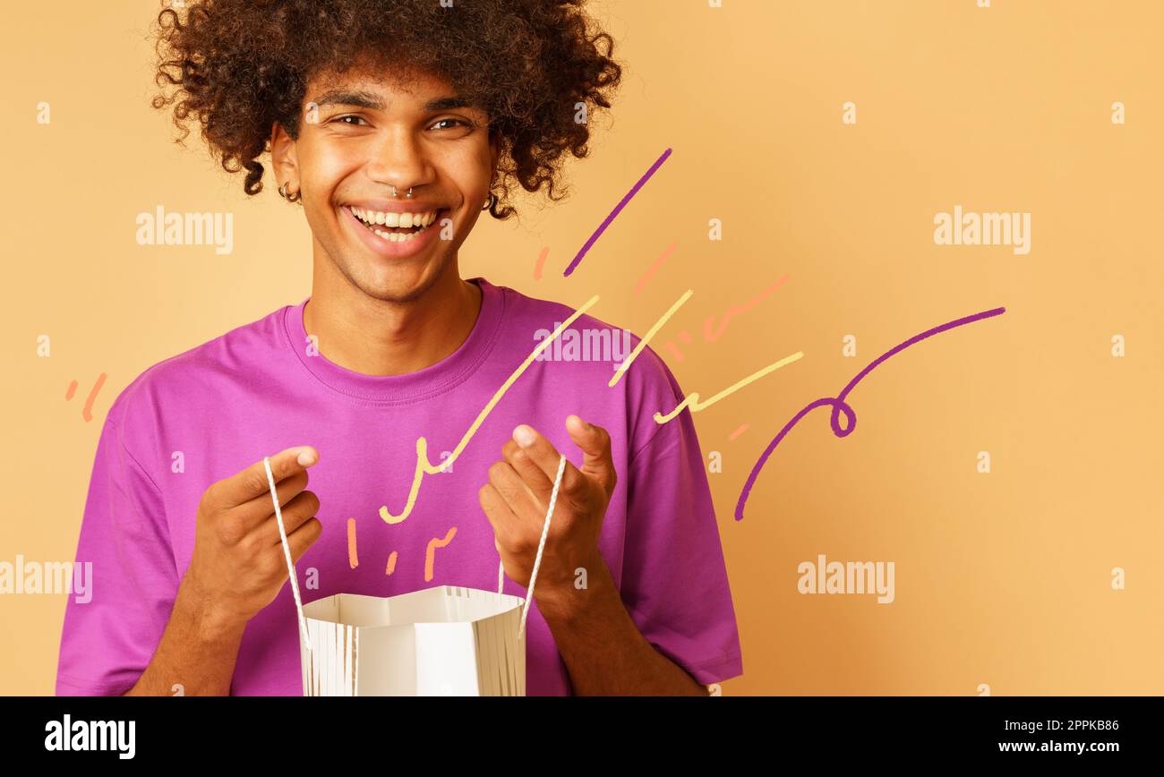 Man with shopping bags in hand. Shopping and consumerism concept Stock Photo