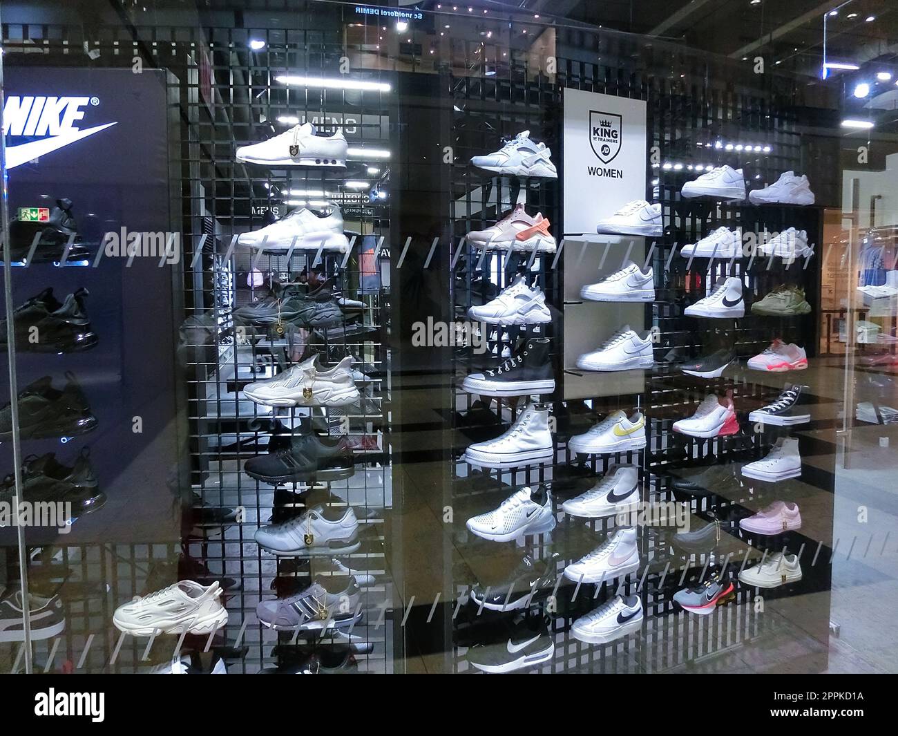 Wall of sneakers inside the sports shop of shoes in the Isenburg-Zentrum, Neu-Isenburg, Germany Stock Photo