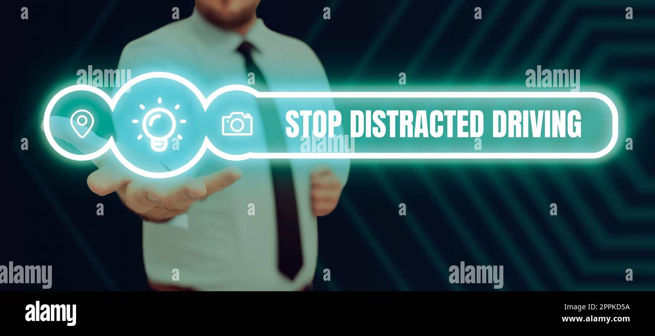 Sign displaying Stop Distracted Driving. Internet Concept asking to be careful behind wheel drive slowly Stock Photo
