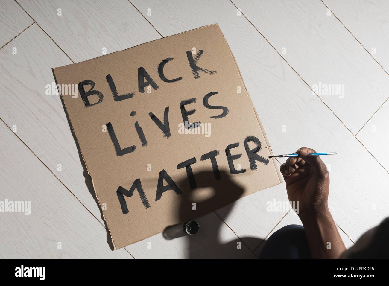 Black lives matter and fight against racism and write sign and words on cardboard - protest concept and blm activism Stock Photo