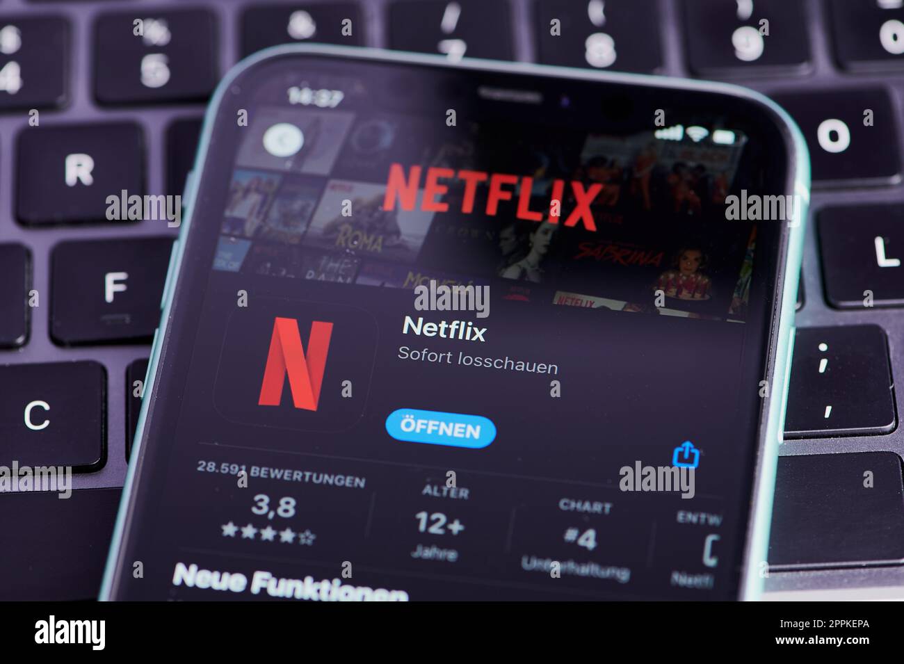 cell phone with netflix icon Stock Photo