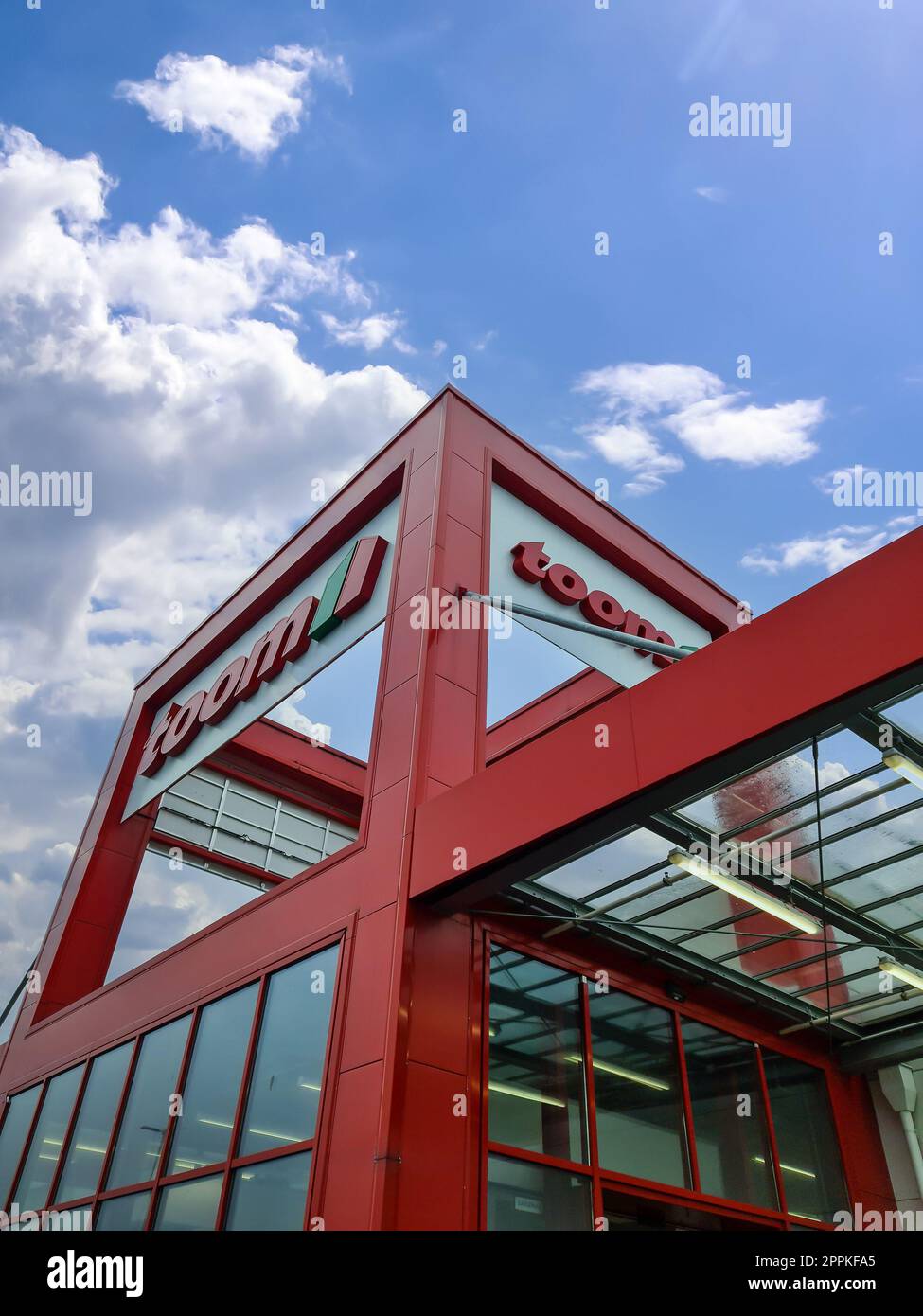 Kiel, Germany - 11 February 2023: Entrance area of the Toom brand furniture store in good weather Stock Photo