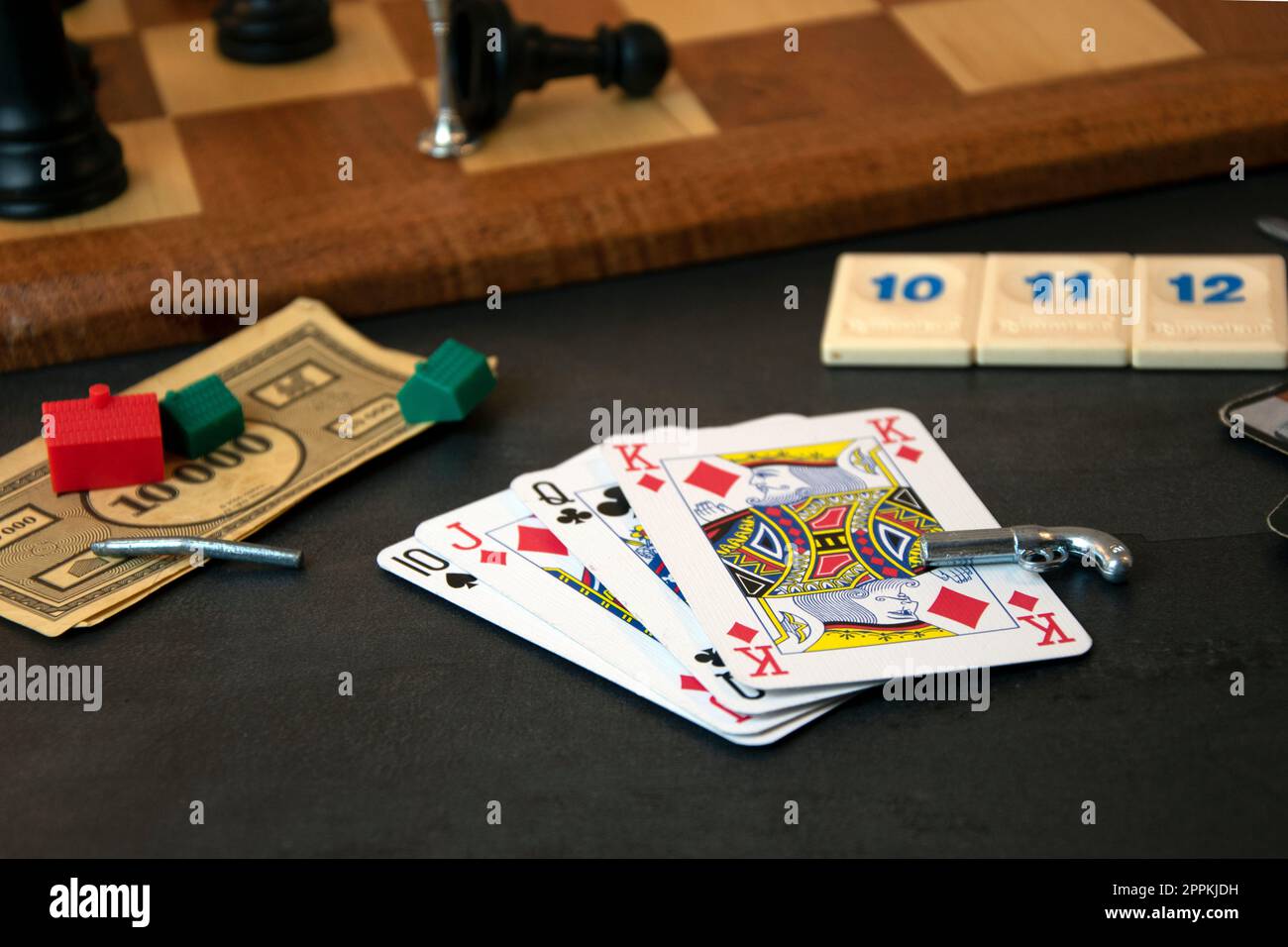 Variety of board game pieces, black background Stock Photo Alamy