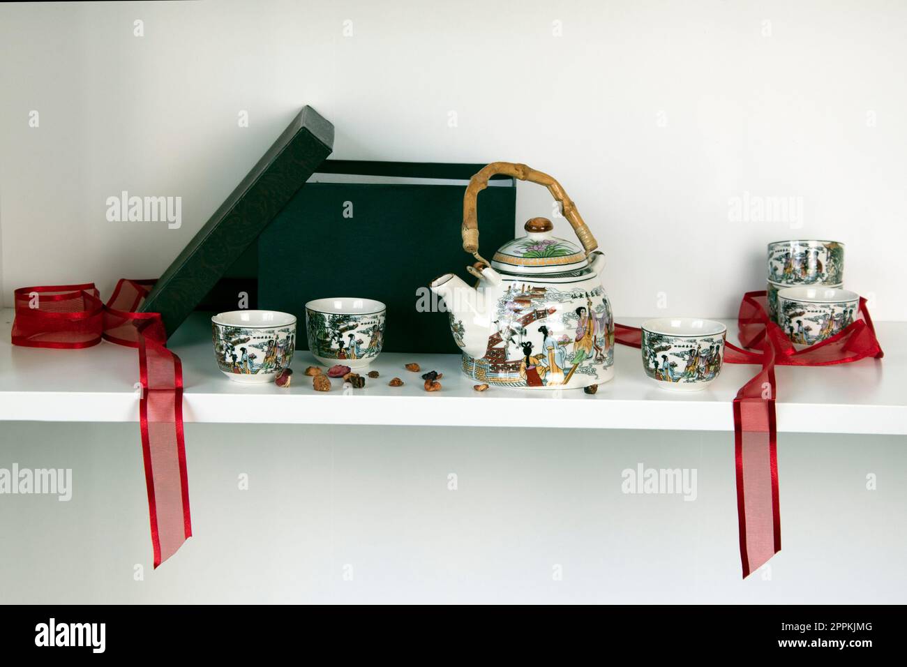 White shelf with quaint chinese tea set Stock Photo