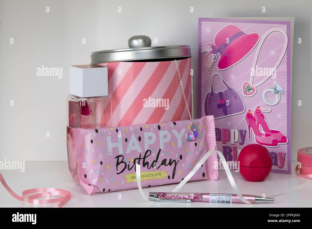 White shelf with pink birthday display Stock Photo
