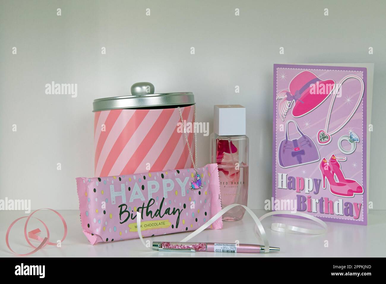 White shelf with pink birthday display Stock Photo