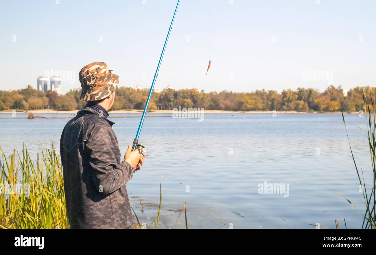 One hand on rod hi-res stock photography and images - Alamy