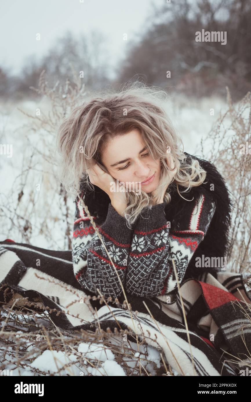 Close up dreaming woman outdoors in winter portrait picture Stock Photo