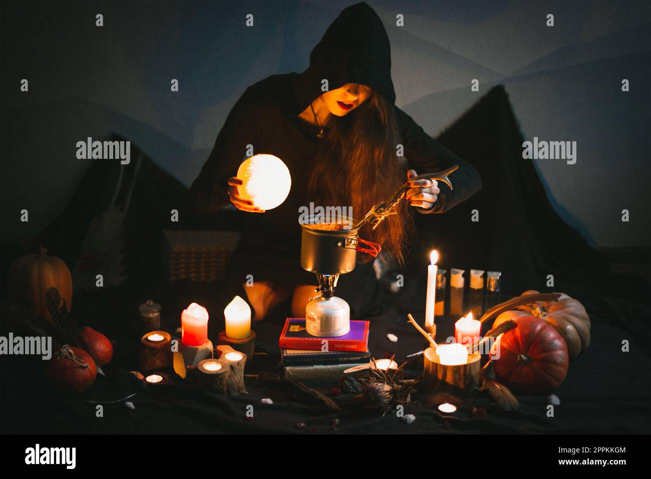 https://c8.alamy.com/comp/2PPKKGM/close-up-surrounded-by-candles-sorceress-preparing-food-portrait-picture-2PPKKGM.jpg