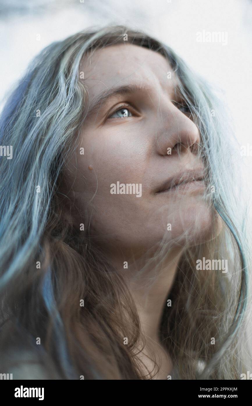 Close up authentic woman with gray hair looking up into sky portrait picture Stock Photo
