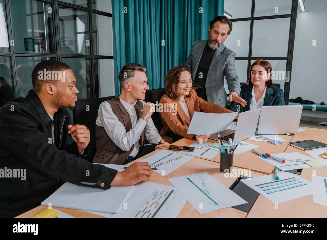 Business people in office connected on internet network analyzing statistics Stock Photo