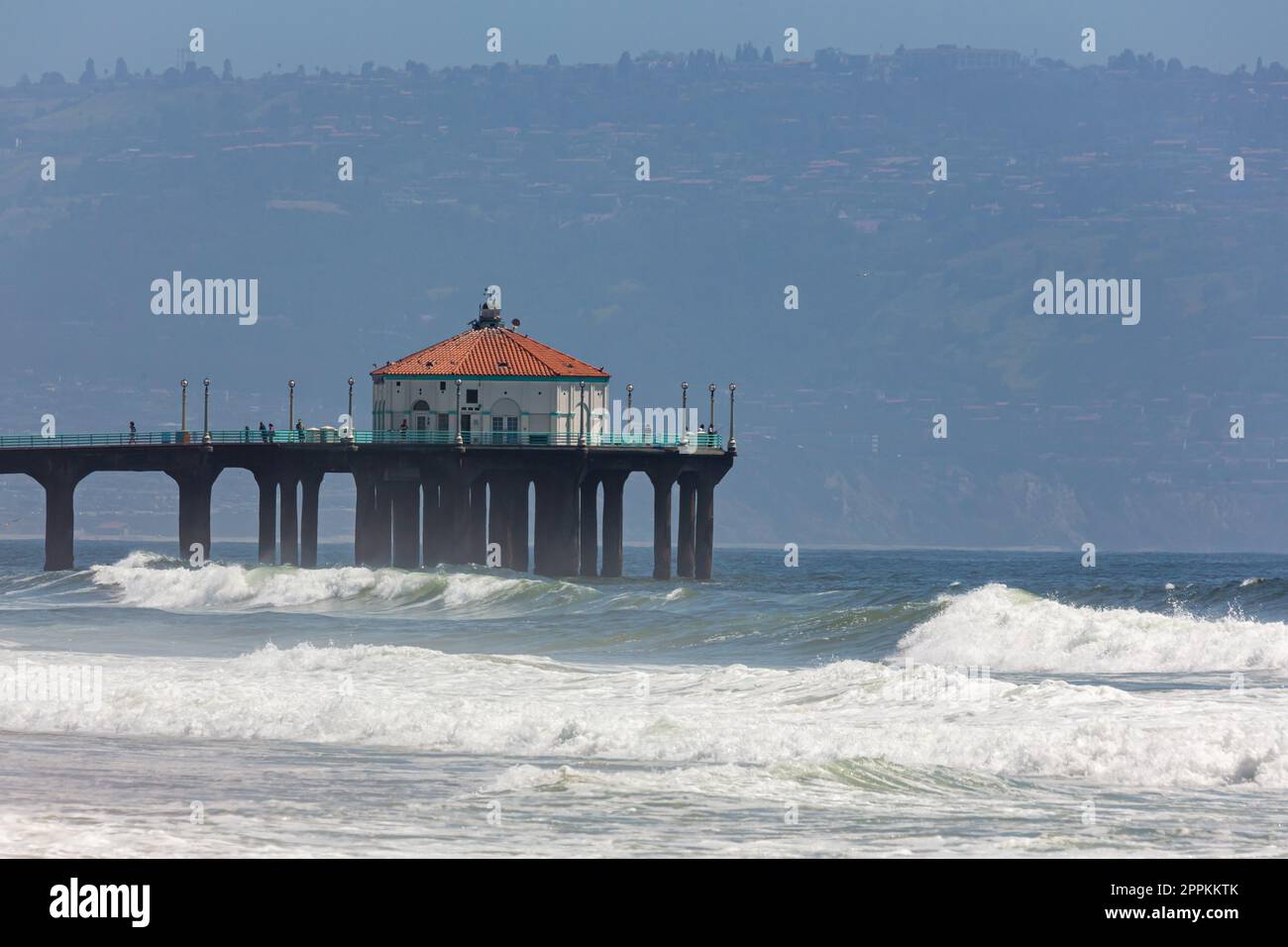 People walk by Manhattan Beach Pier, close up Stock Photo