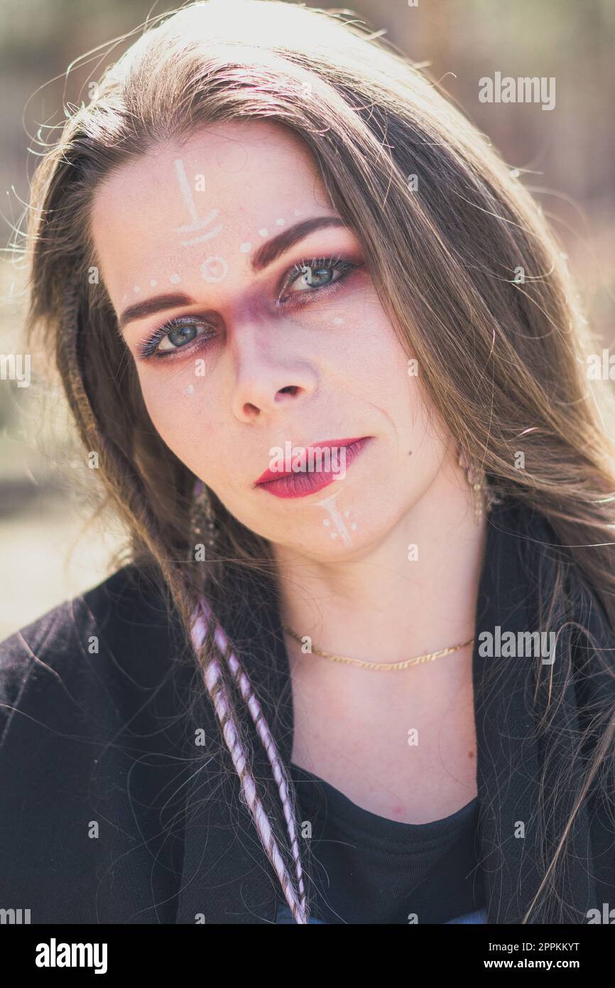 Close up strange lady presenting old shaman traditions portrait picture Stock Photo