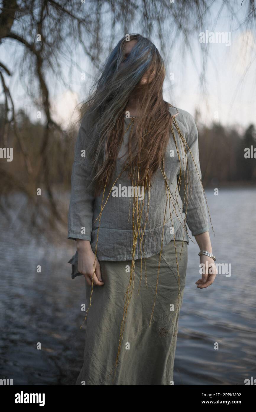 Close up wind blowing hair over adult woman face portrait picture Stock Photo