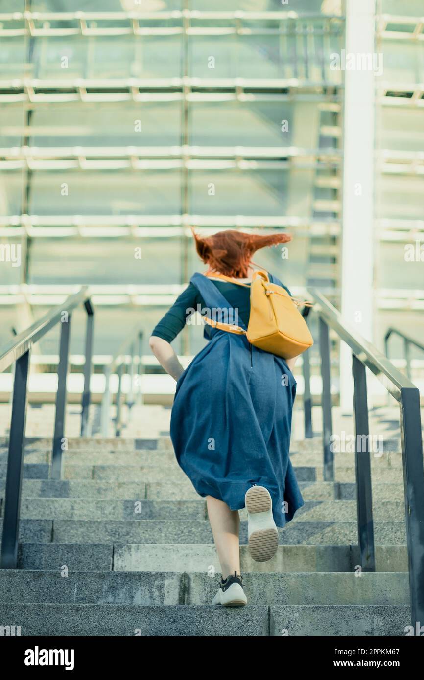 Girl walking up stairs hires stock photography and images Alamy