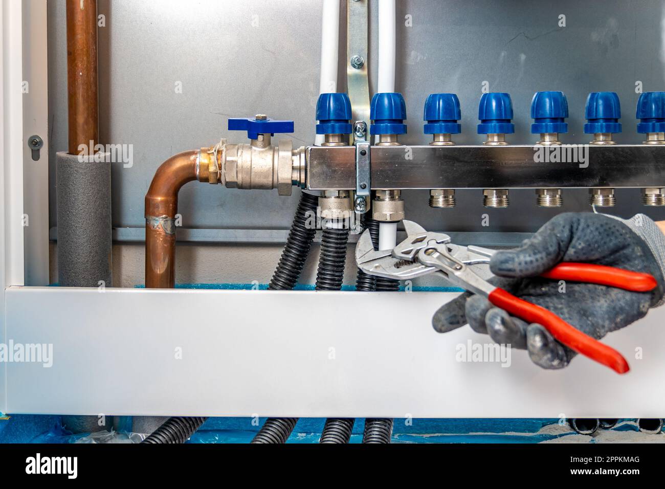 connecting the floor heating to the switchboard Stock Photo