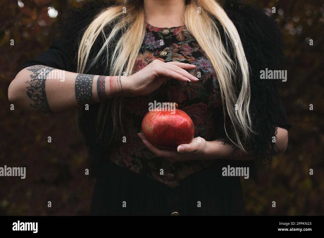 Close up woman holding pomegranate concept photo Stock Photo