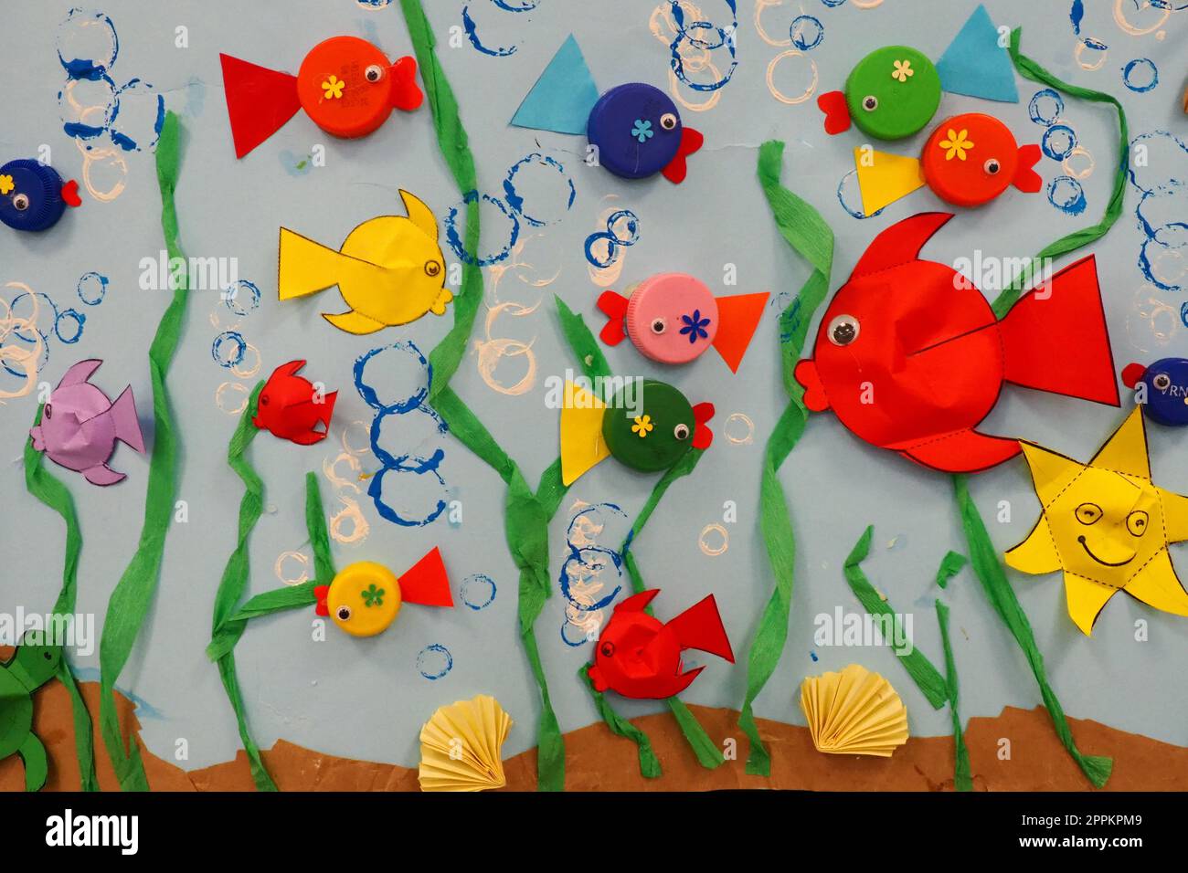 Children's application aquarium. Multicolored bright fish, starfish