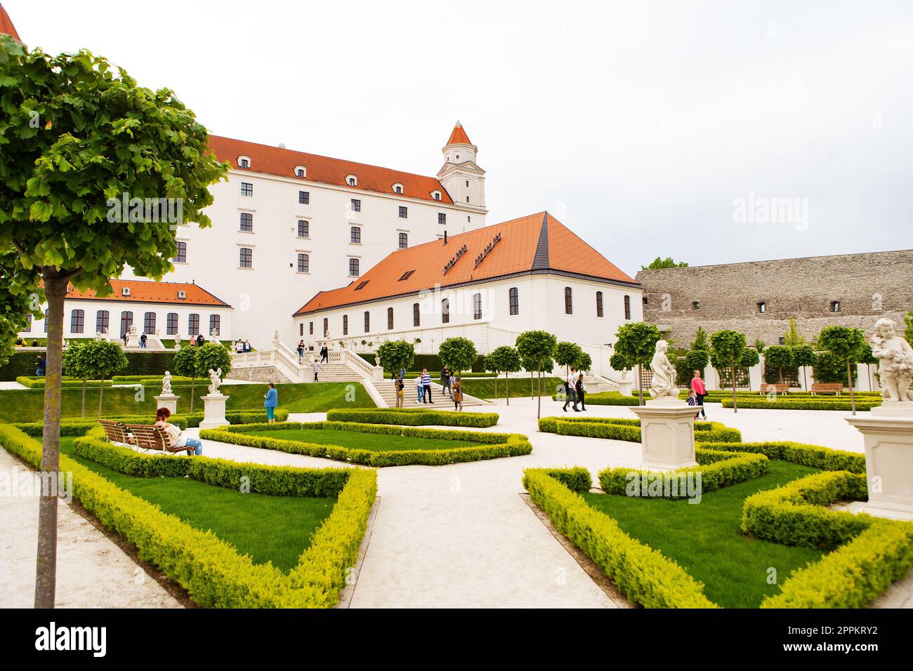 The courtyard garden of the baroque castle of Bratislava. The castle stands on an isolated rocky hill directly above the Danube River in the center of Bratislava, Slovakia. Stock Photo