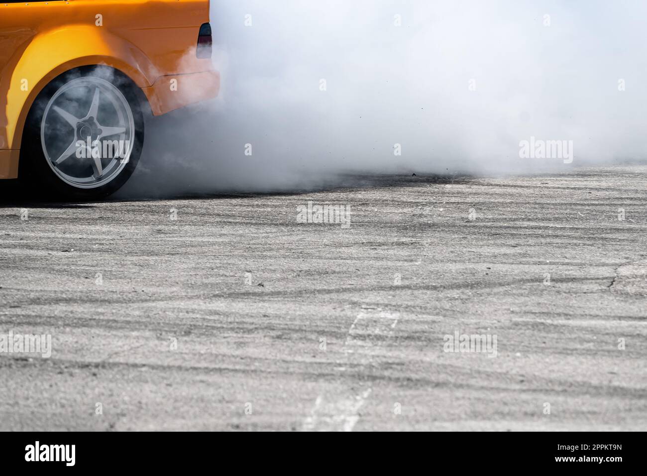 Premium Photo, Top view drifting car, aerial view professional driver  drifting car on race track.