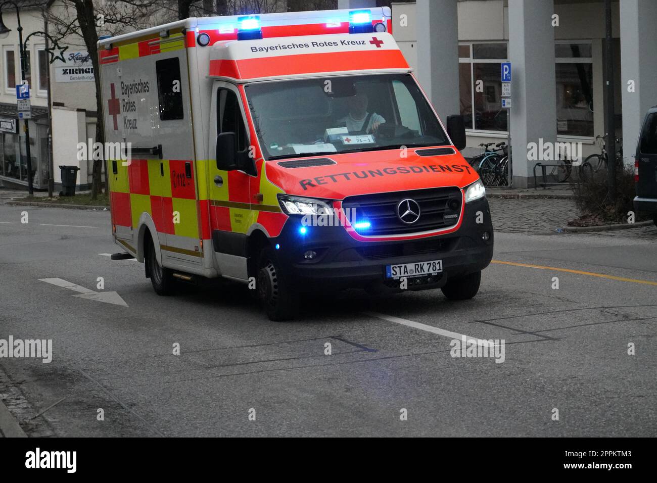 An ambulance of the German Red Cross drives to an emergency with