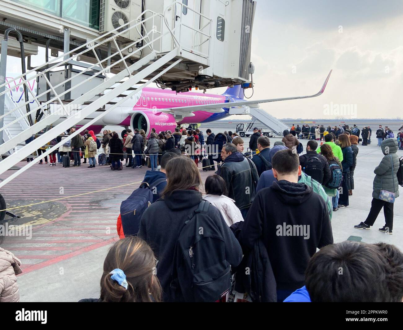 queue of passengers to board of plane in Yerevan Stock Photo