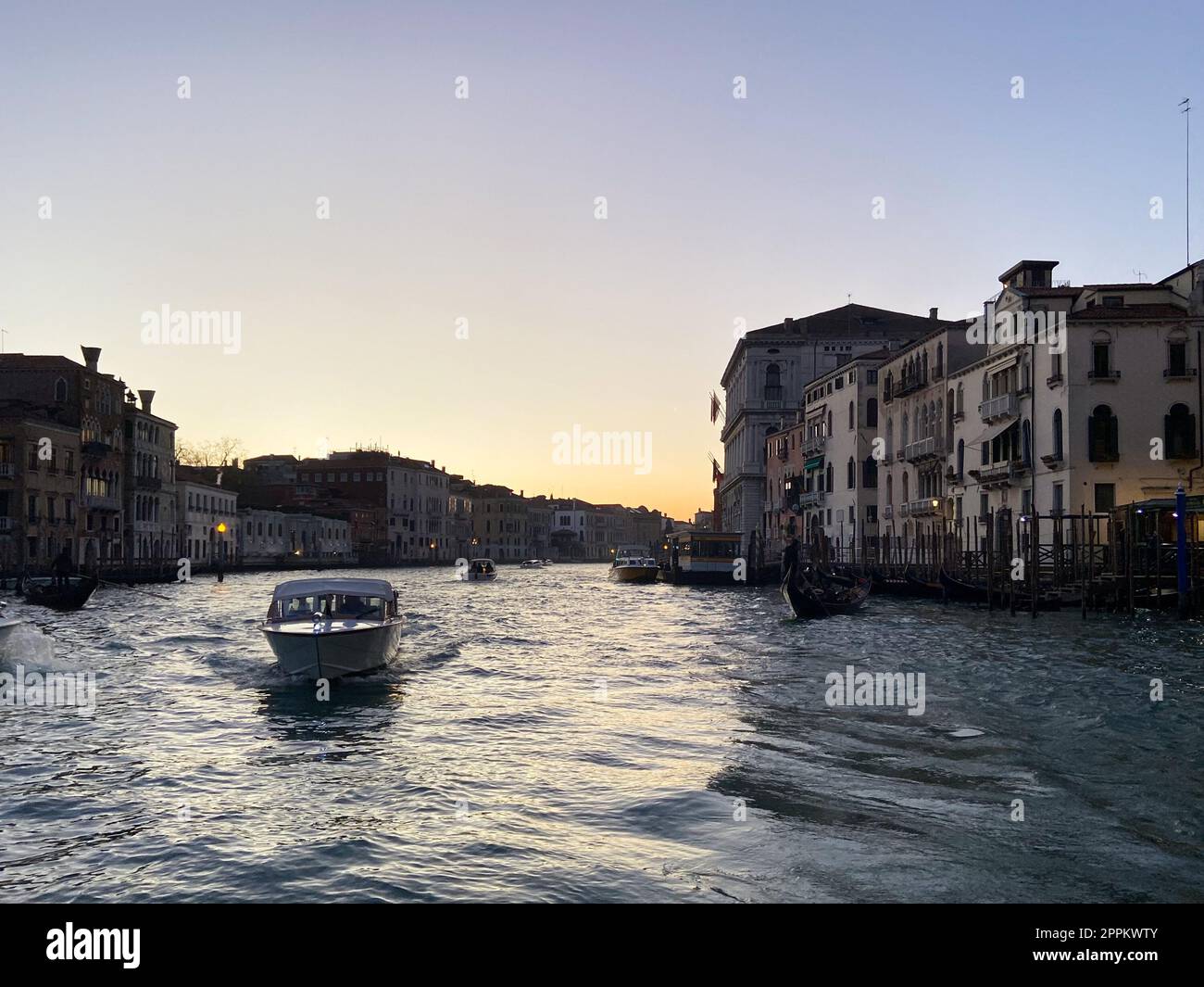 boat in Grand Canal in Venice city in evening Stock Photo