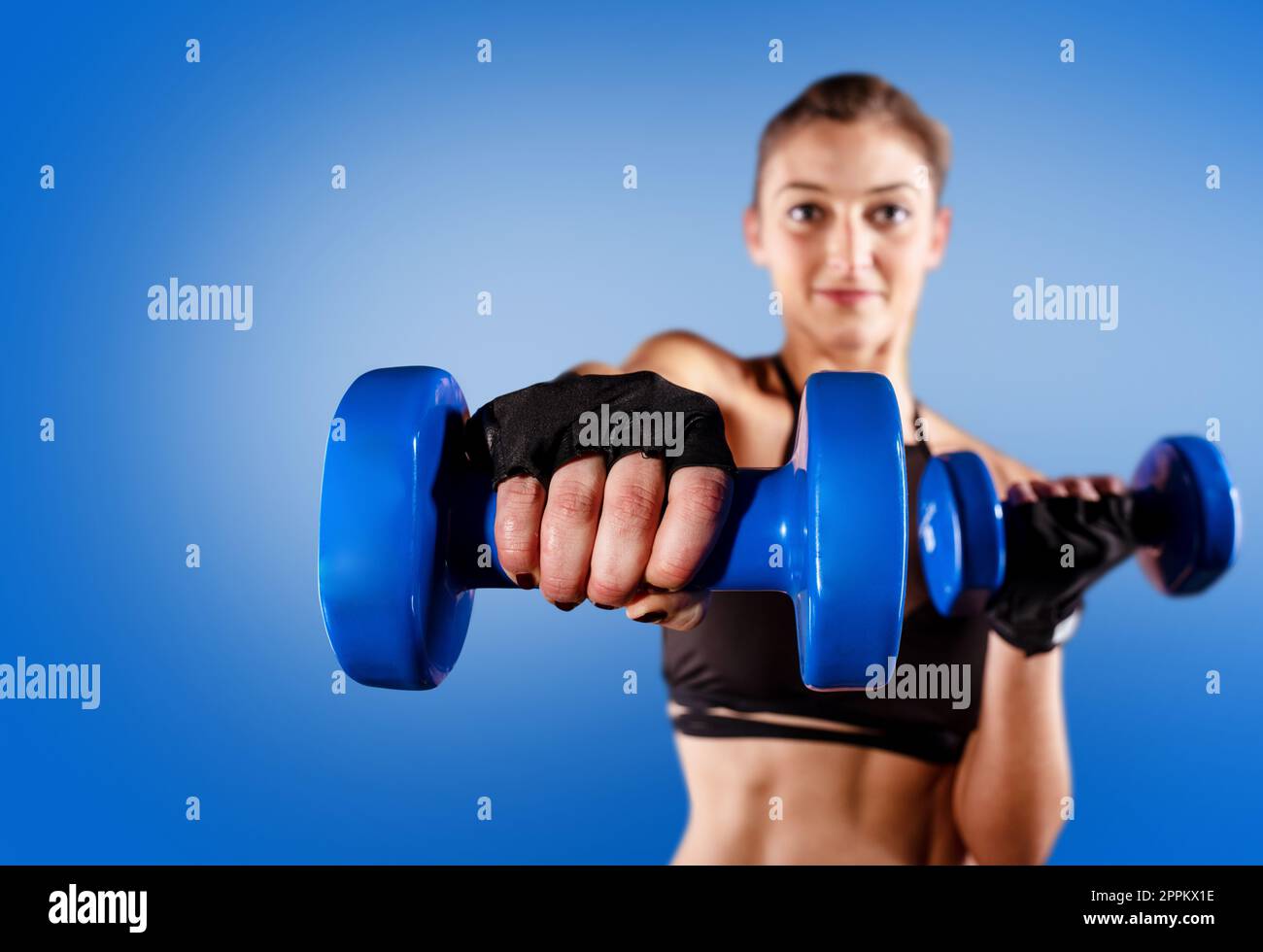 Determinated girl at the gym ready to start fitness lesson Stock Photo