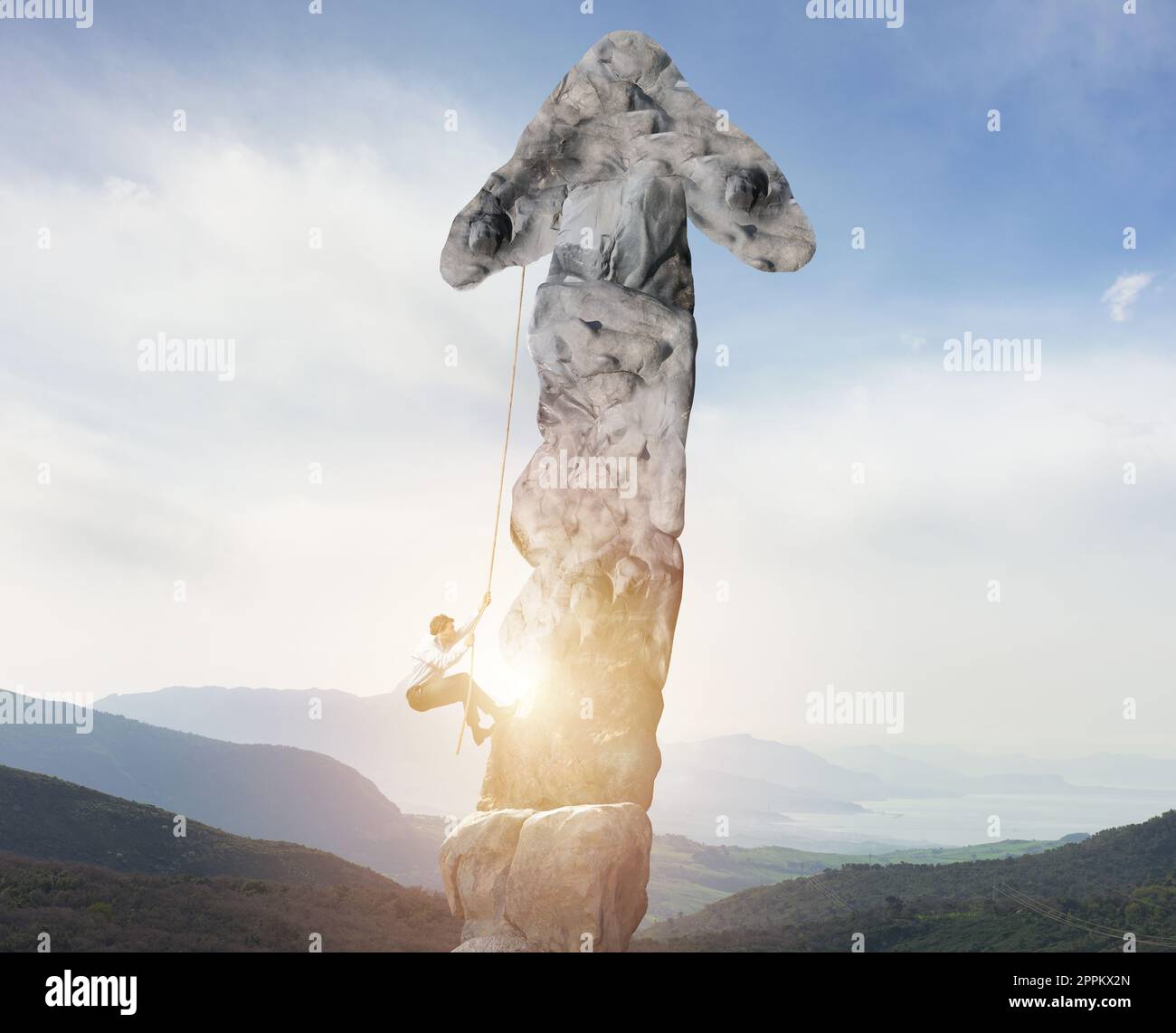 Businessman climbs a mountain shaped as an arrow. concept of statistics improvement Stock Photo