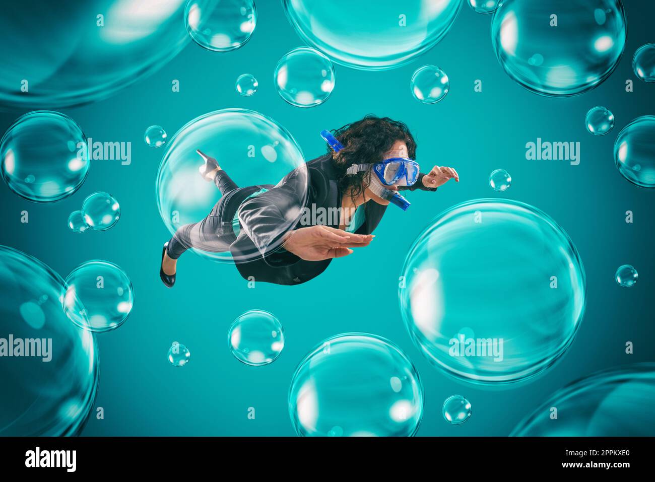 Woman swimming among air bubbles with mask and snorkel in a deep