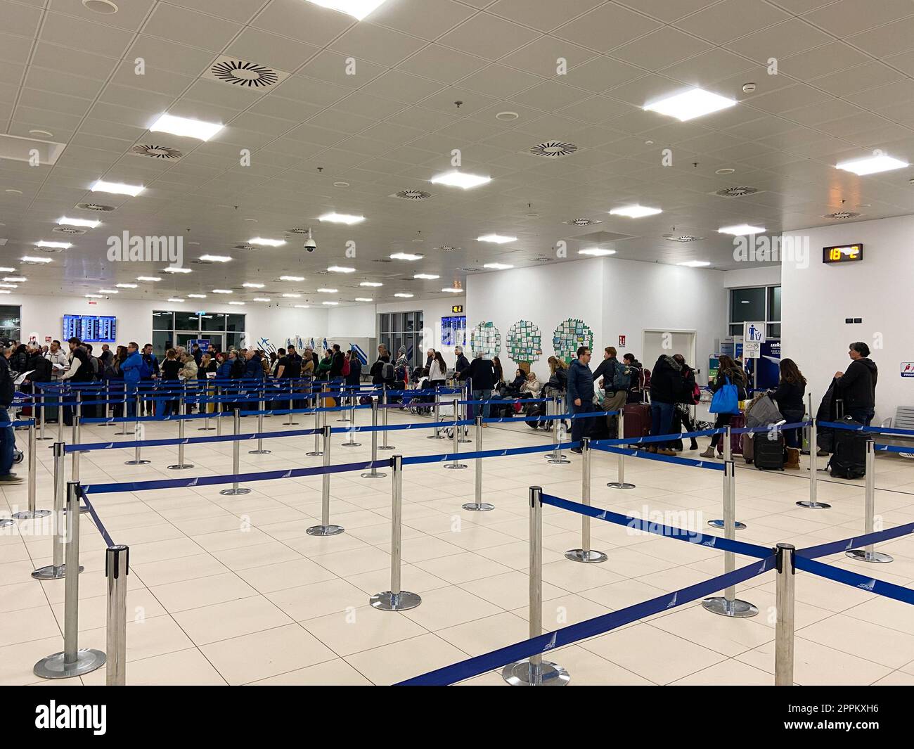 queue of tourists for passport control in airport Stock Photo