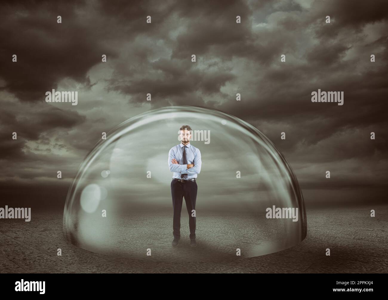 Businessman safely inside a shield dome during a storm that protects him. Protection and safety concept Stock Photo
