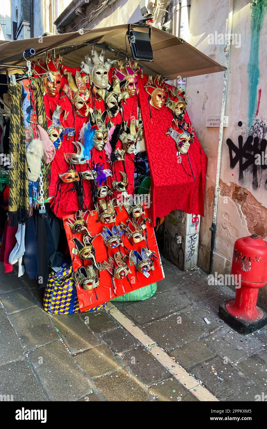 masquerade masks on stall during Venetian carnival Stock Photo
