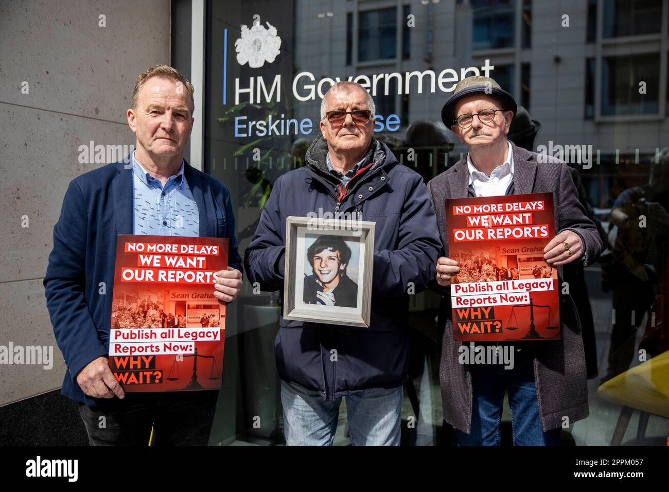 (left to right) JJ Magee, Billy Campbell, holding an image of his brother Tony TC Campbell, and Daniel McCready stand with Time for Truth and Justice campaigners during a protest against the Northern Ireland Troubles (Legacy and Reconciliation) Bill outside the Northern Ireland Office (NIO) at Erskine House in Belfast. Picture date: Monday April 23 2023. Stock Photo