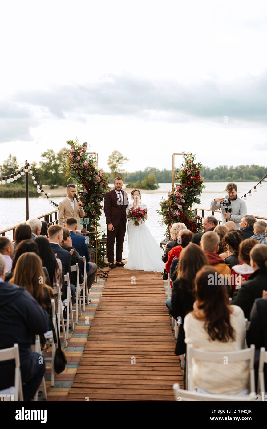 wedding ceremony of the newlyweds on the pier Stock Photo Alamy
