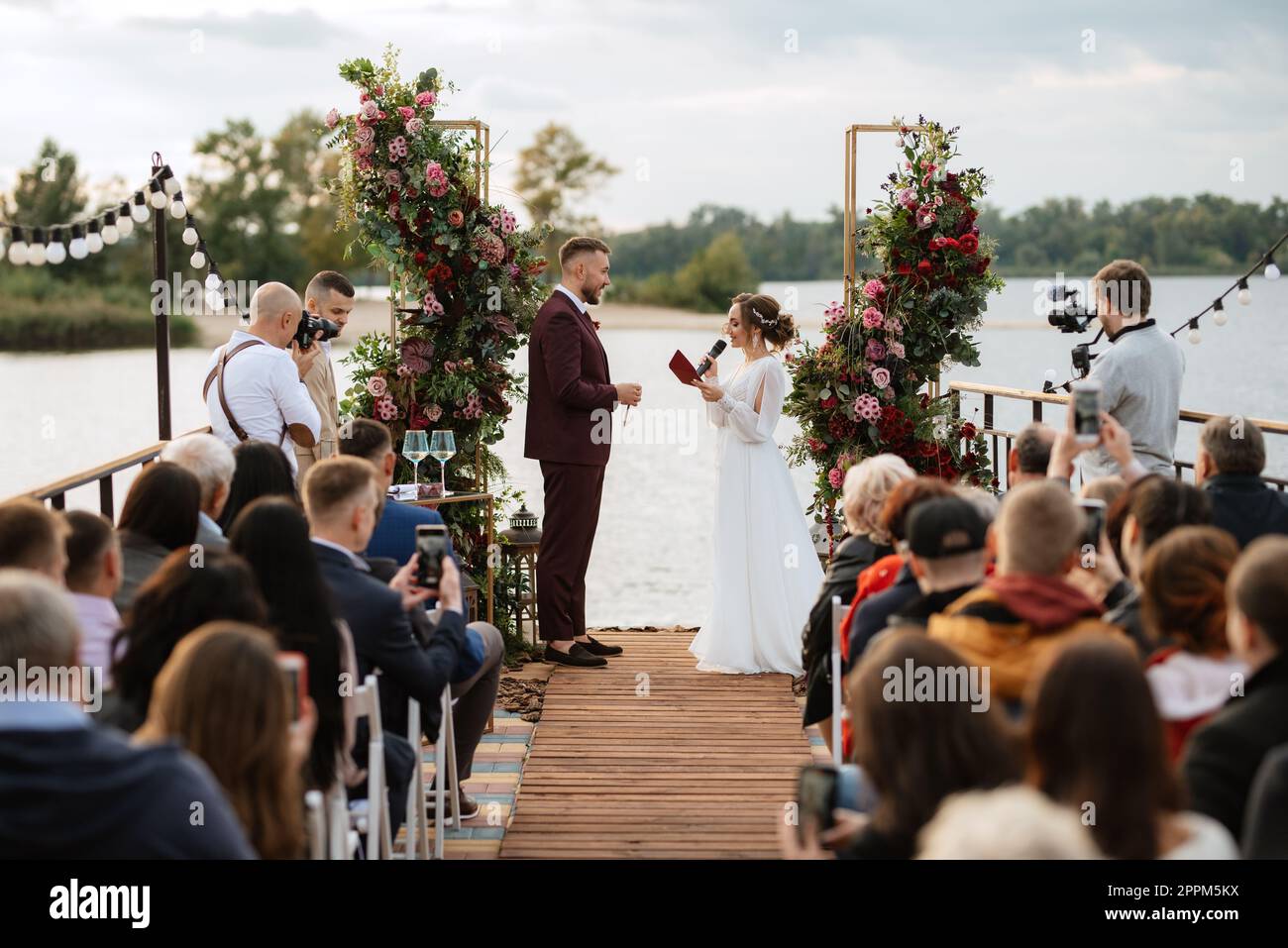 wedding ceremony of the newlyweds on the pier Stock Photo Alamy