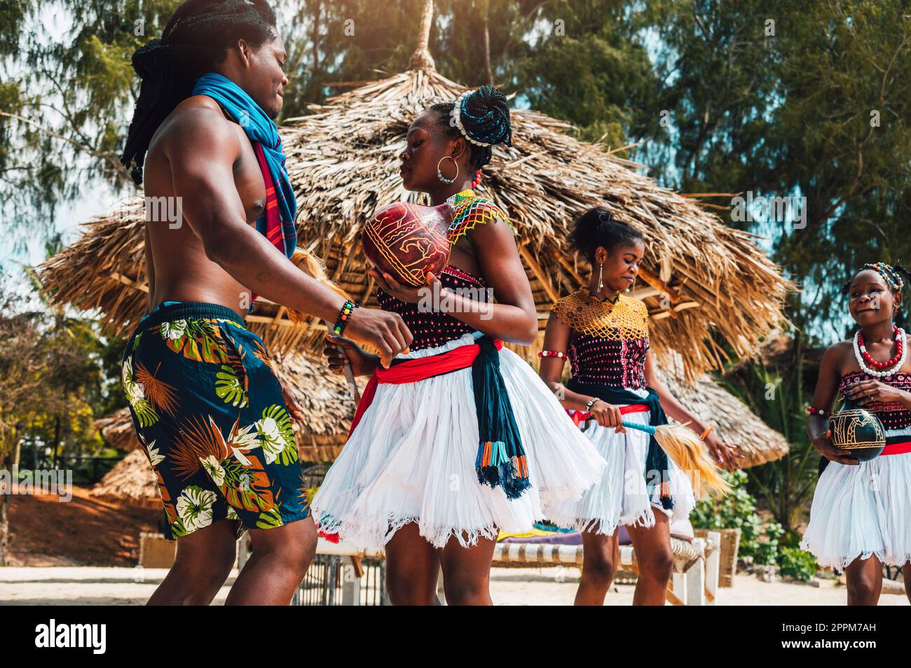 Kenyan people dance on the beach with typical local clothes Stock Photo Alamy