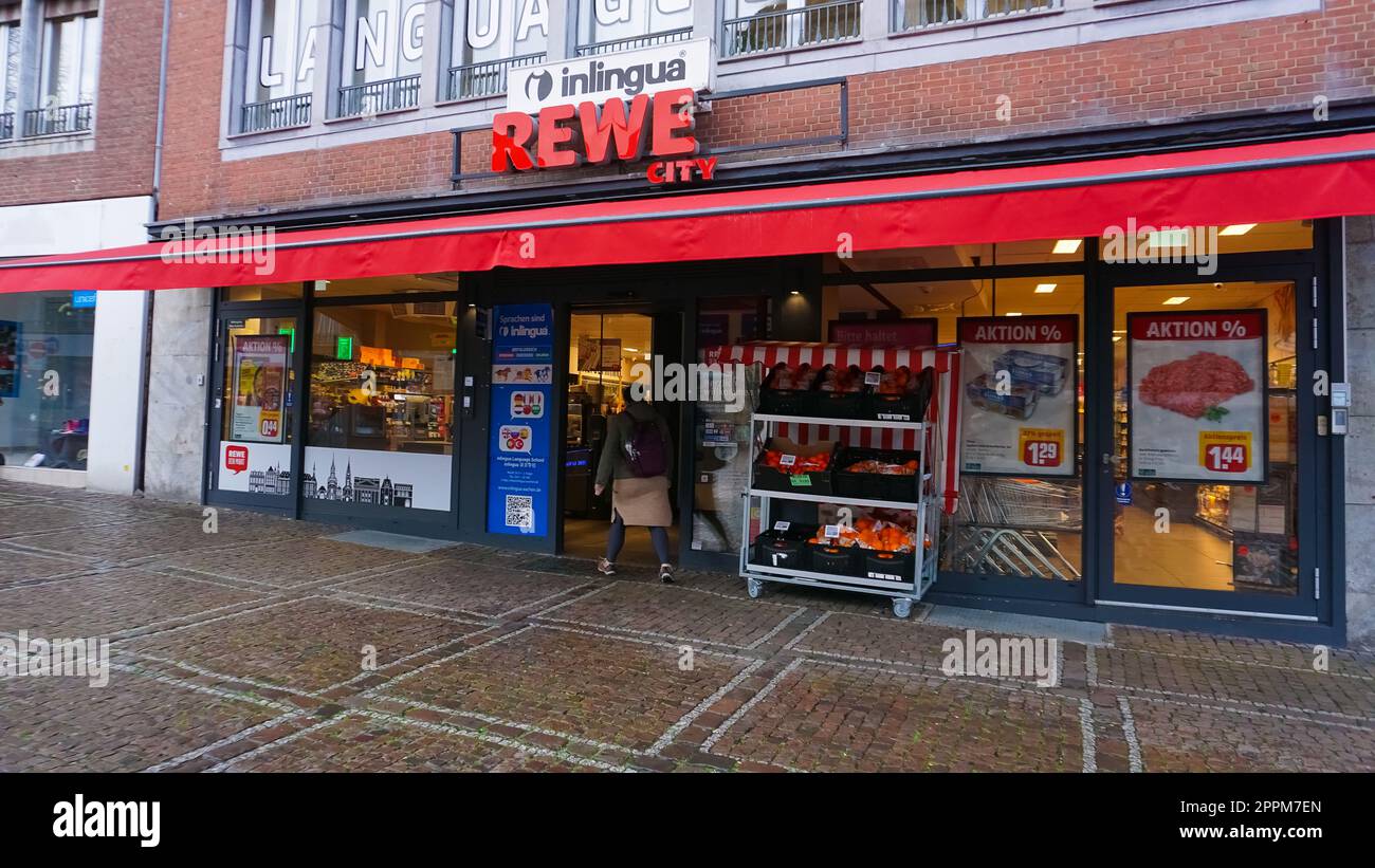 The entrance of a Rewe supermarket. Stock Photo
